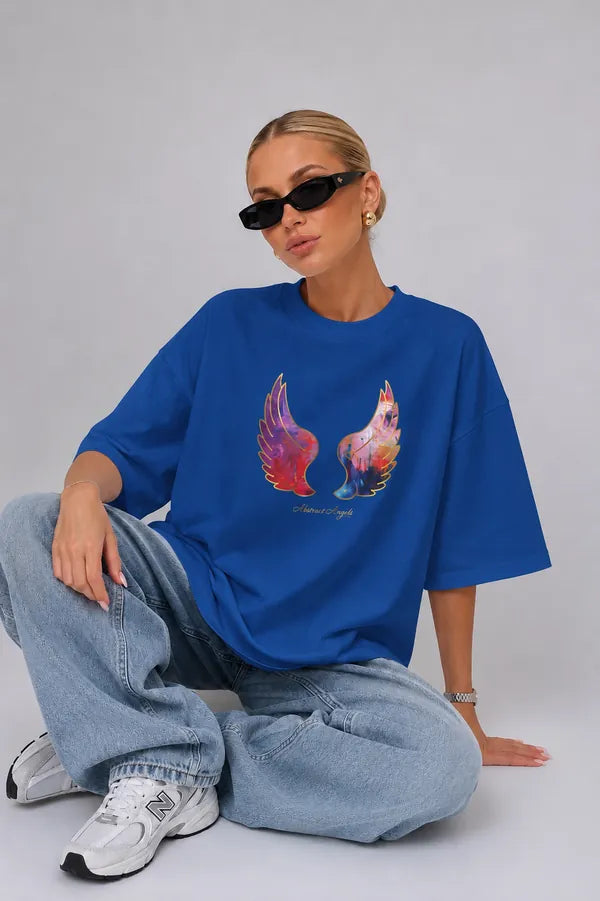 Blue T-shirt with colorful angel wings styled with a relaxed look