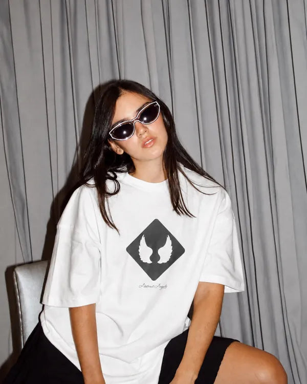 White graphic T-shirt styled for an editorial portrait